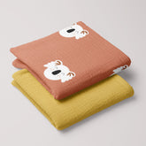 Folded Happy Koala swaddle and mustard 4-ply muslin baby blanket set